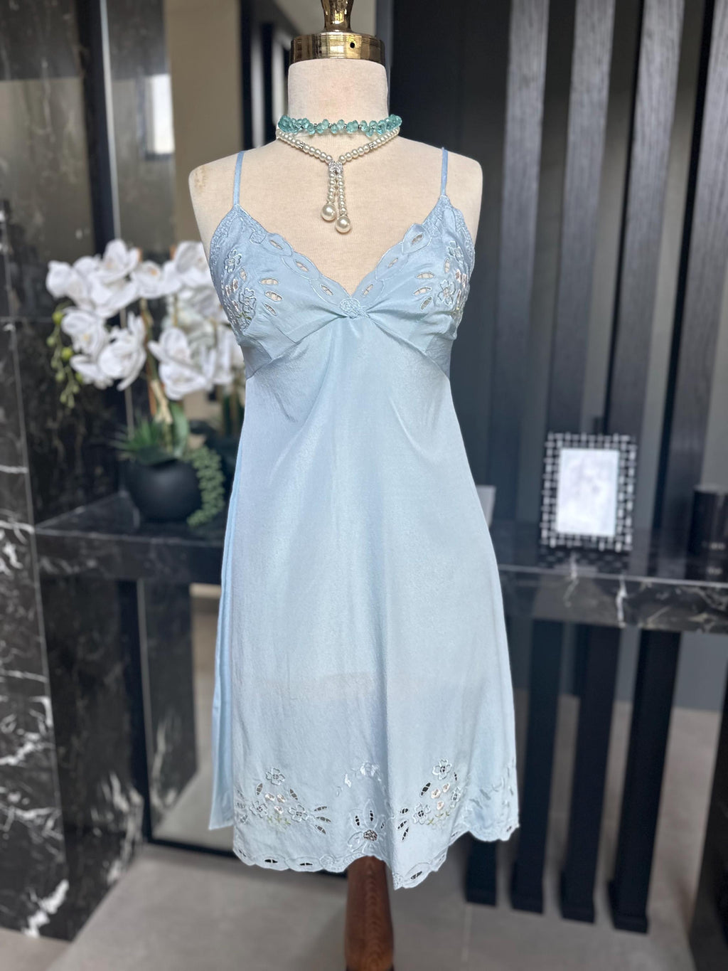 1970s baby blue short satin slip dress with embroidery to the front.