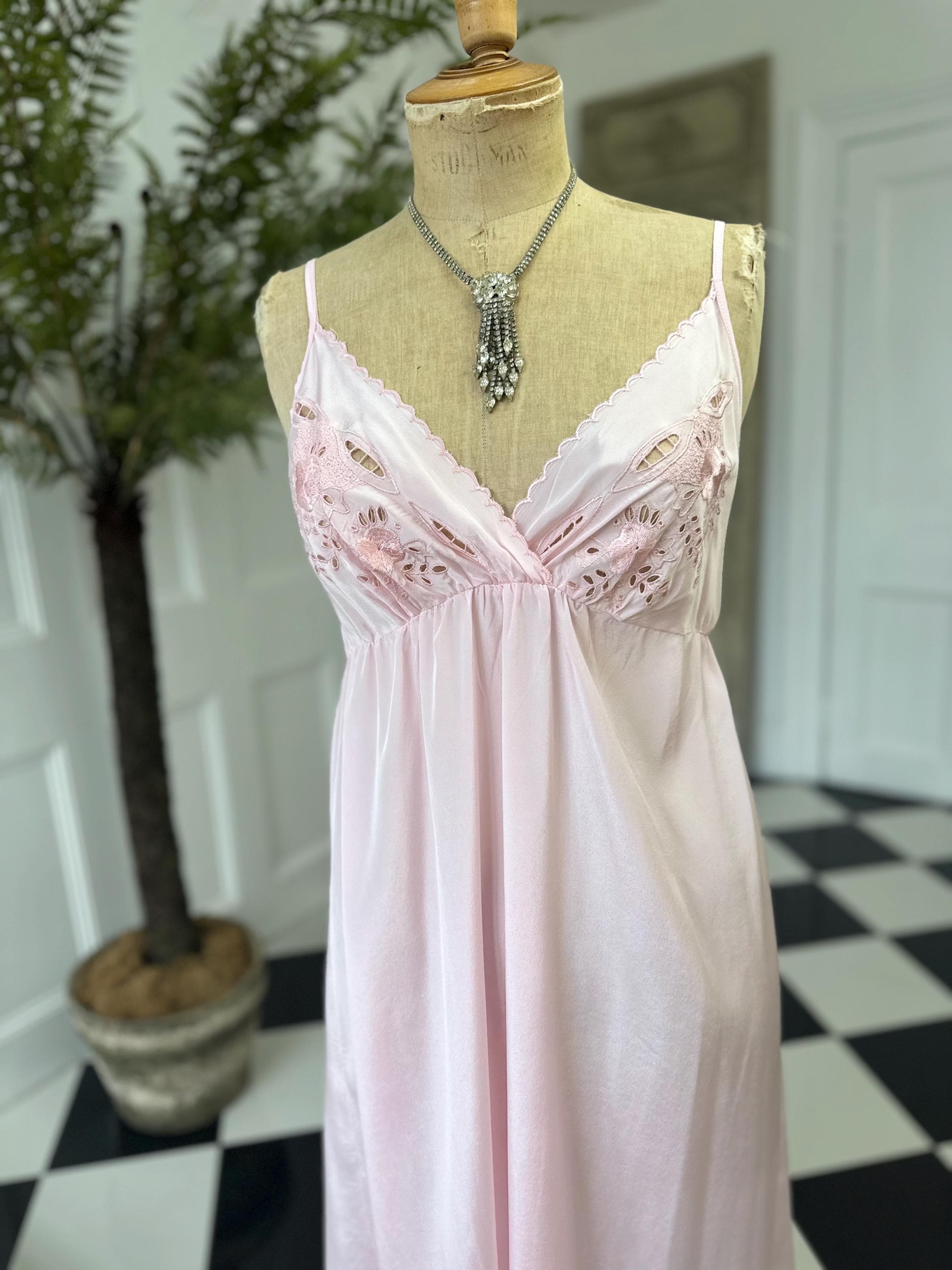 1970s long slip dress in baby pink with embroidery to the front.