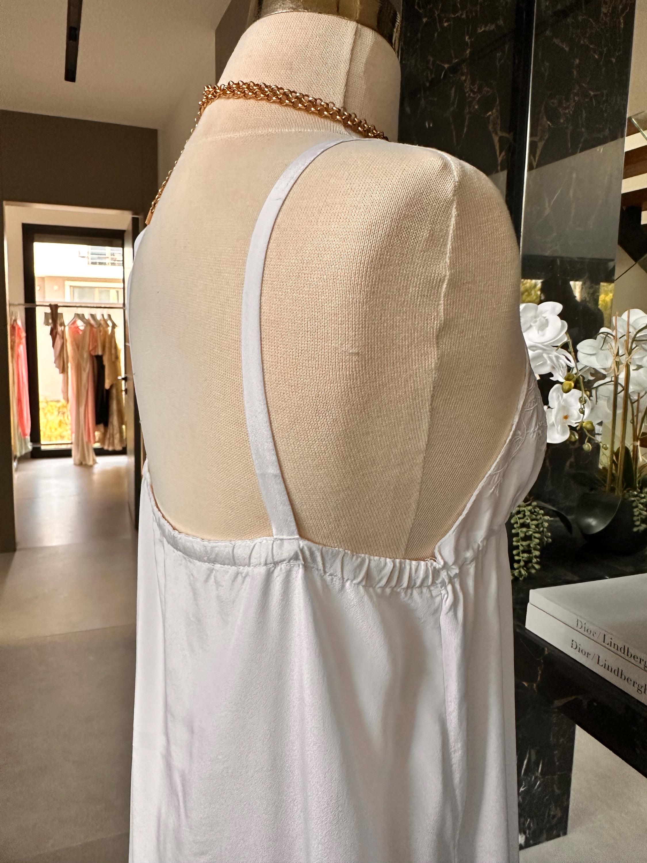 1970s white long satin slip dress with embroidery to the front.