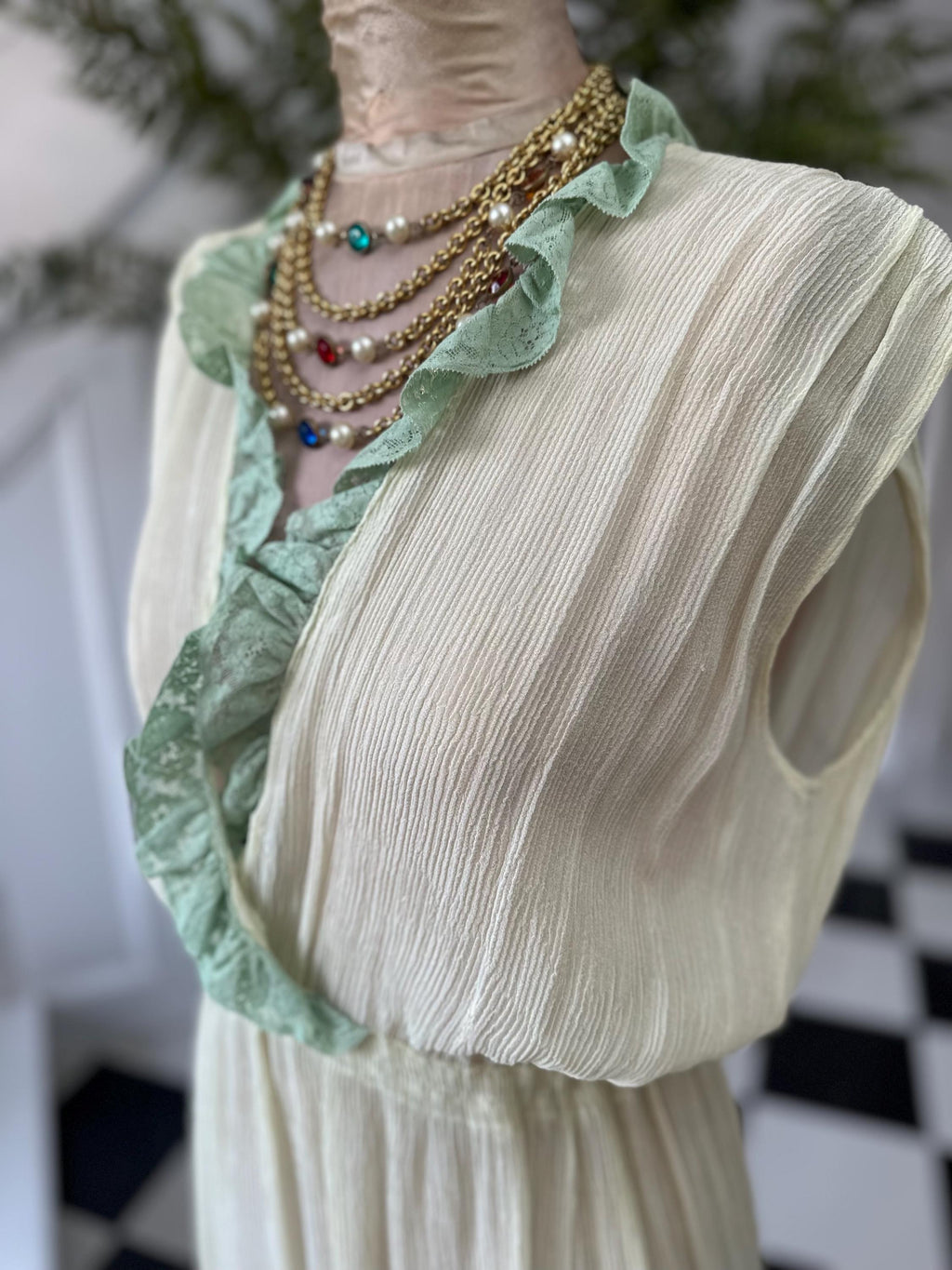 1970s plunge neckline dress in silk crepe  and lace in pale green