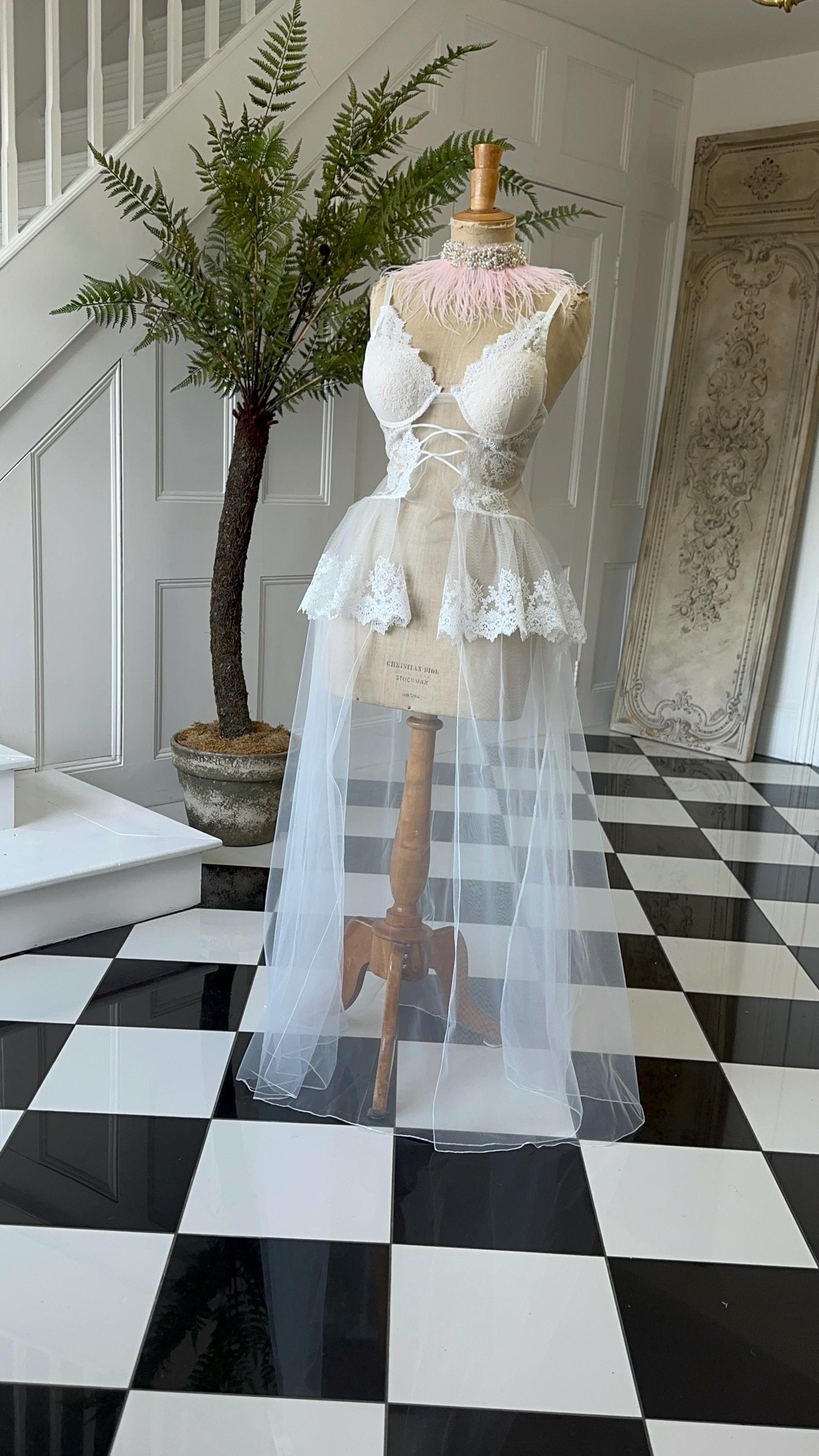 The Seraphina corded lace bridal bustier gown with scolloped peplum and tiered tulle