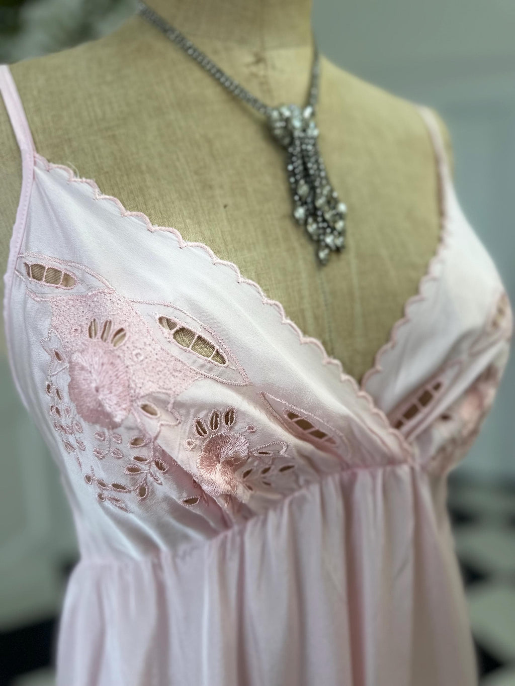 1970s long slip dress in baby pink with embroidery to the front.