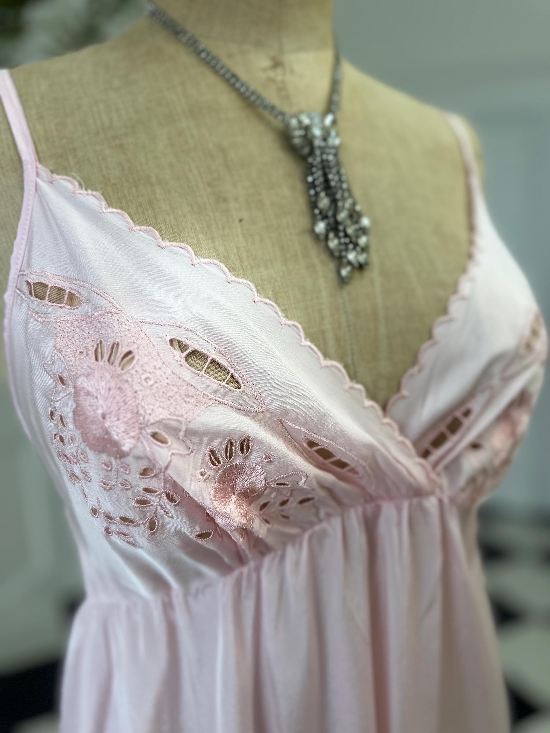 1970s long slip dress in baby pink with embroidery to the front.