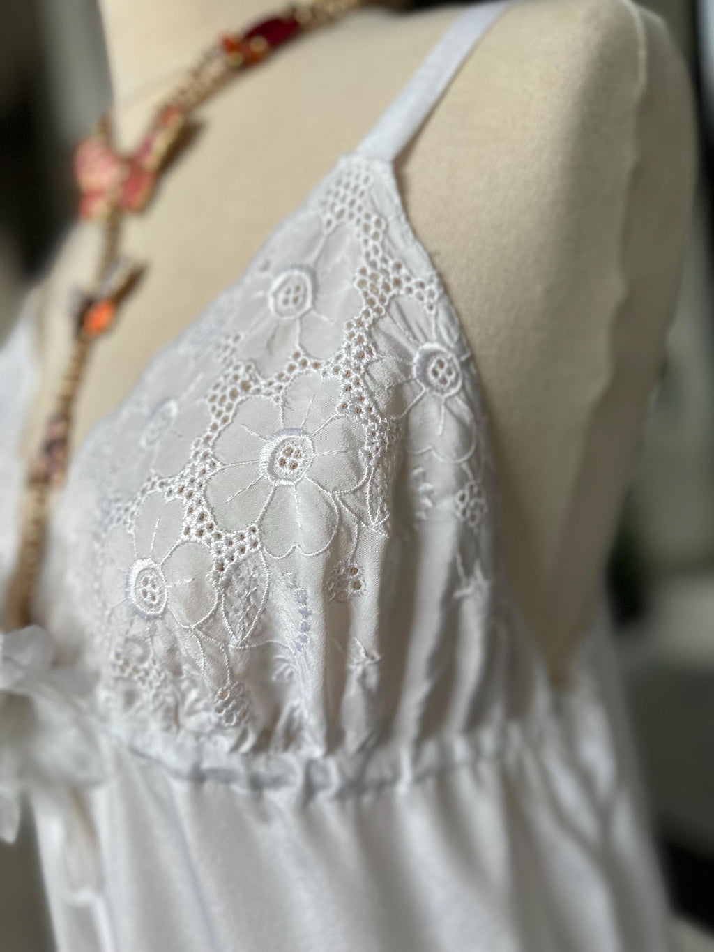 1970s white long satin slip dress with embroidery to the front.