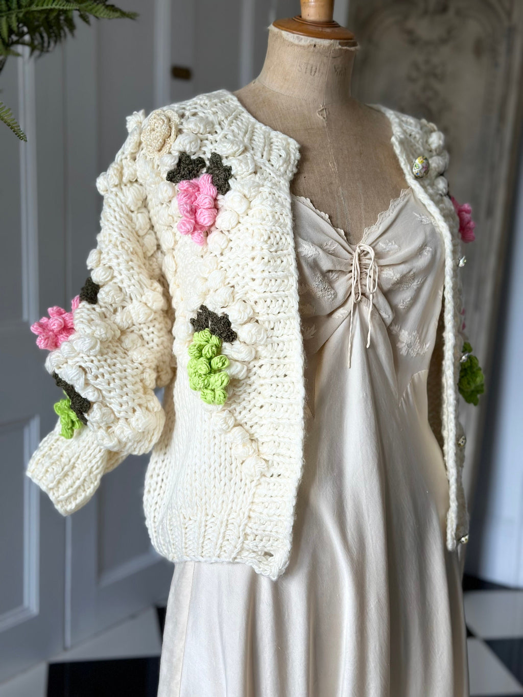 Vintage style hand knitted cream cardigan with grape details