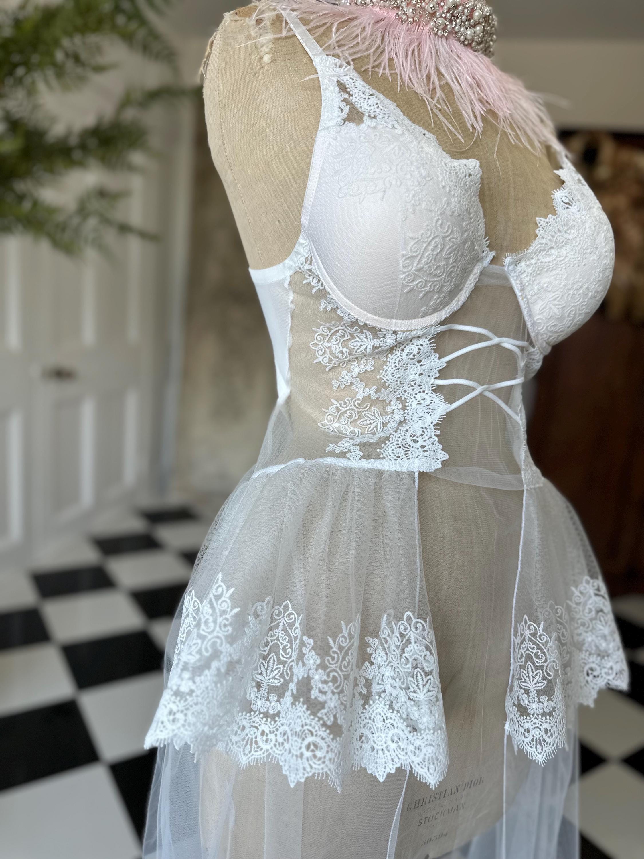 The Seraphina corded lace bridal bustier gown with scolloped peplum and tiered tulle