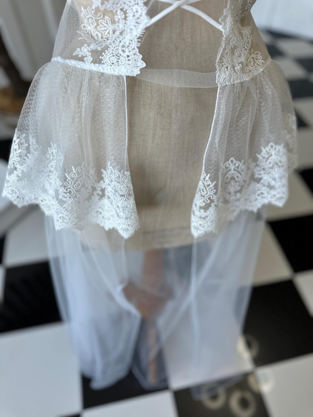 The Seraphina corded lace bridal bustier gown with scolloped peplum and tiered tulle