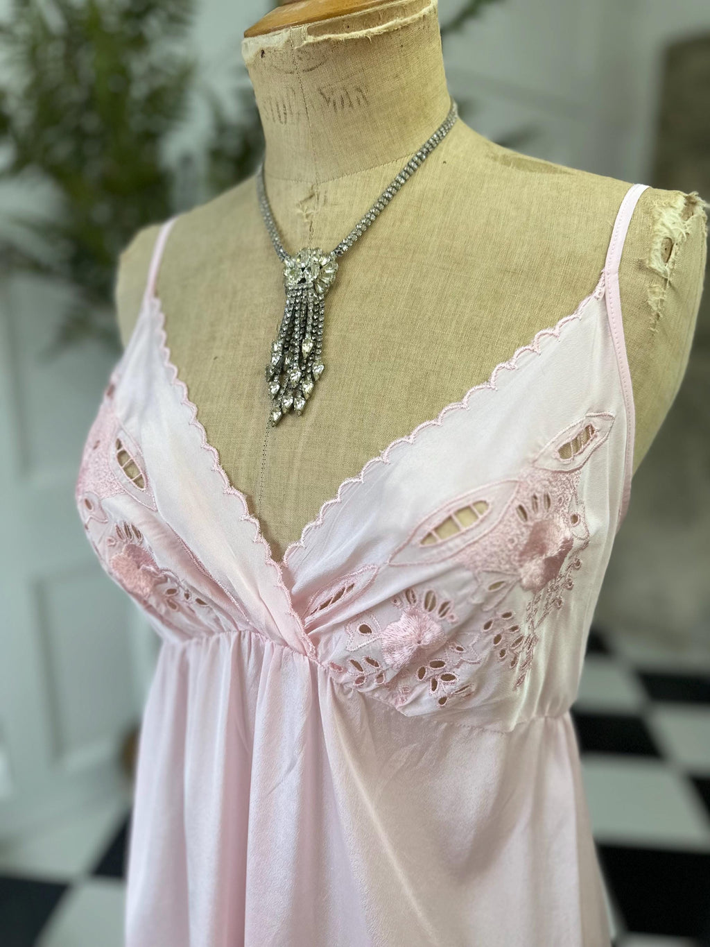 1970s long slip dress in baby pink with embroidery to the front.