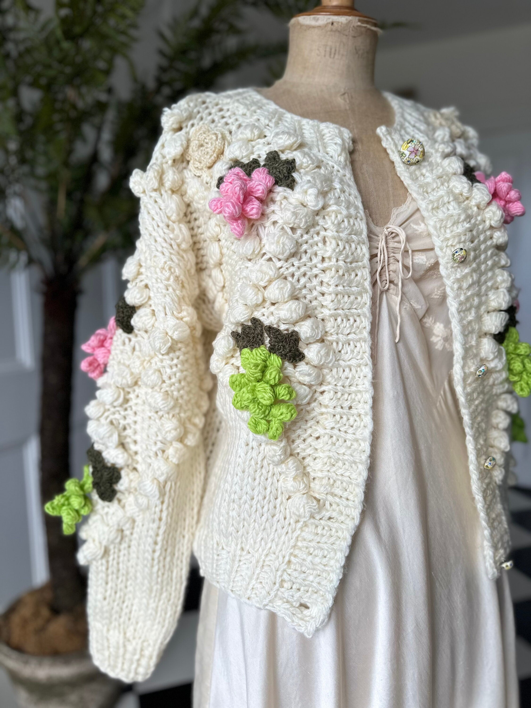 Vintage style hand knitted cream cardigan with grape details