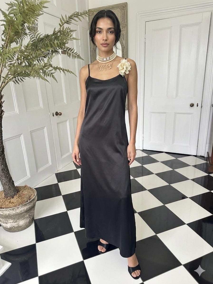 Vintage style long bias cut black slip dress.