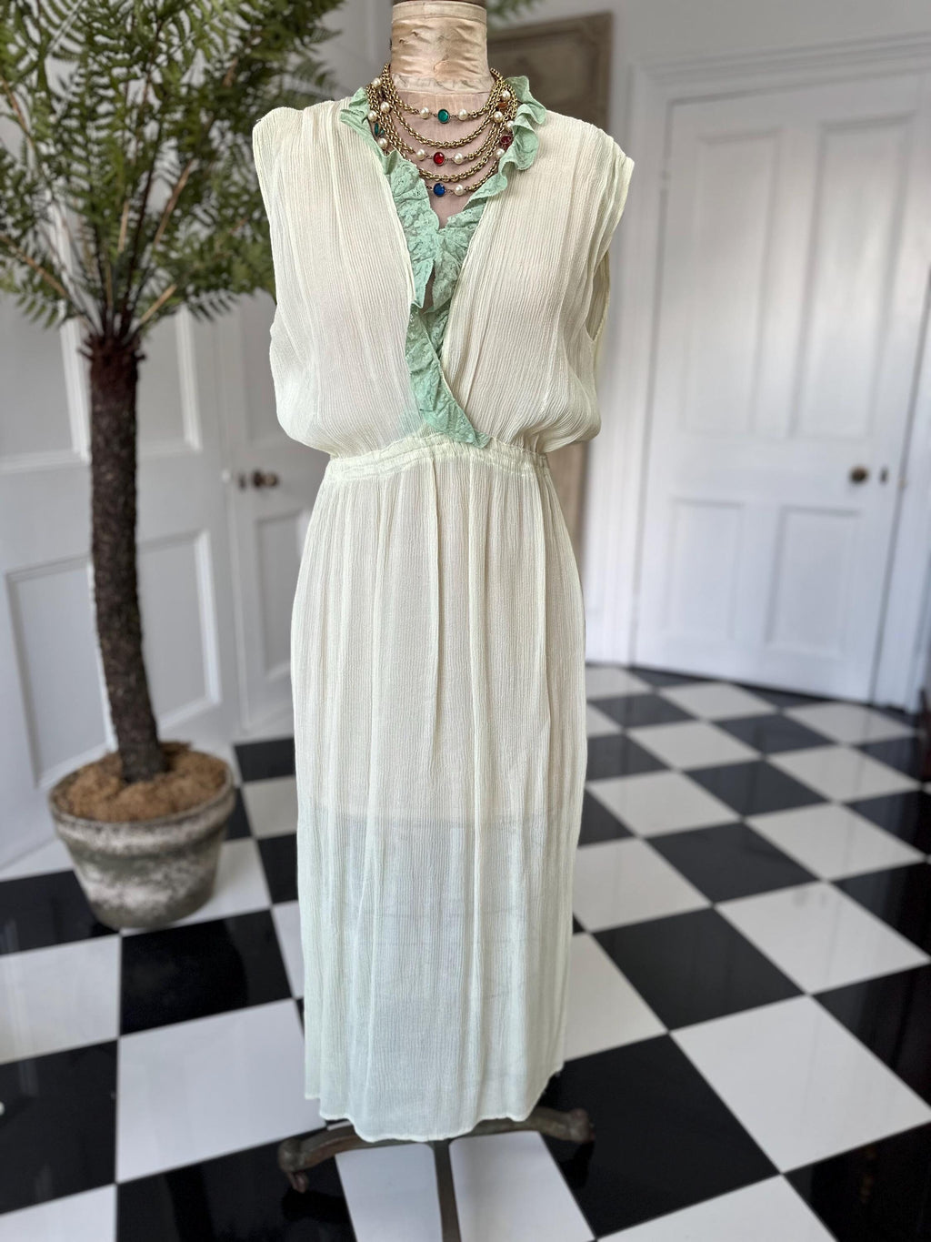 1970s plunge neckline dress in silk crepe  and lace in pale green