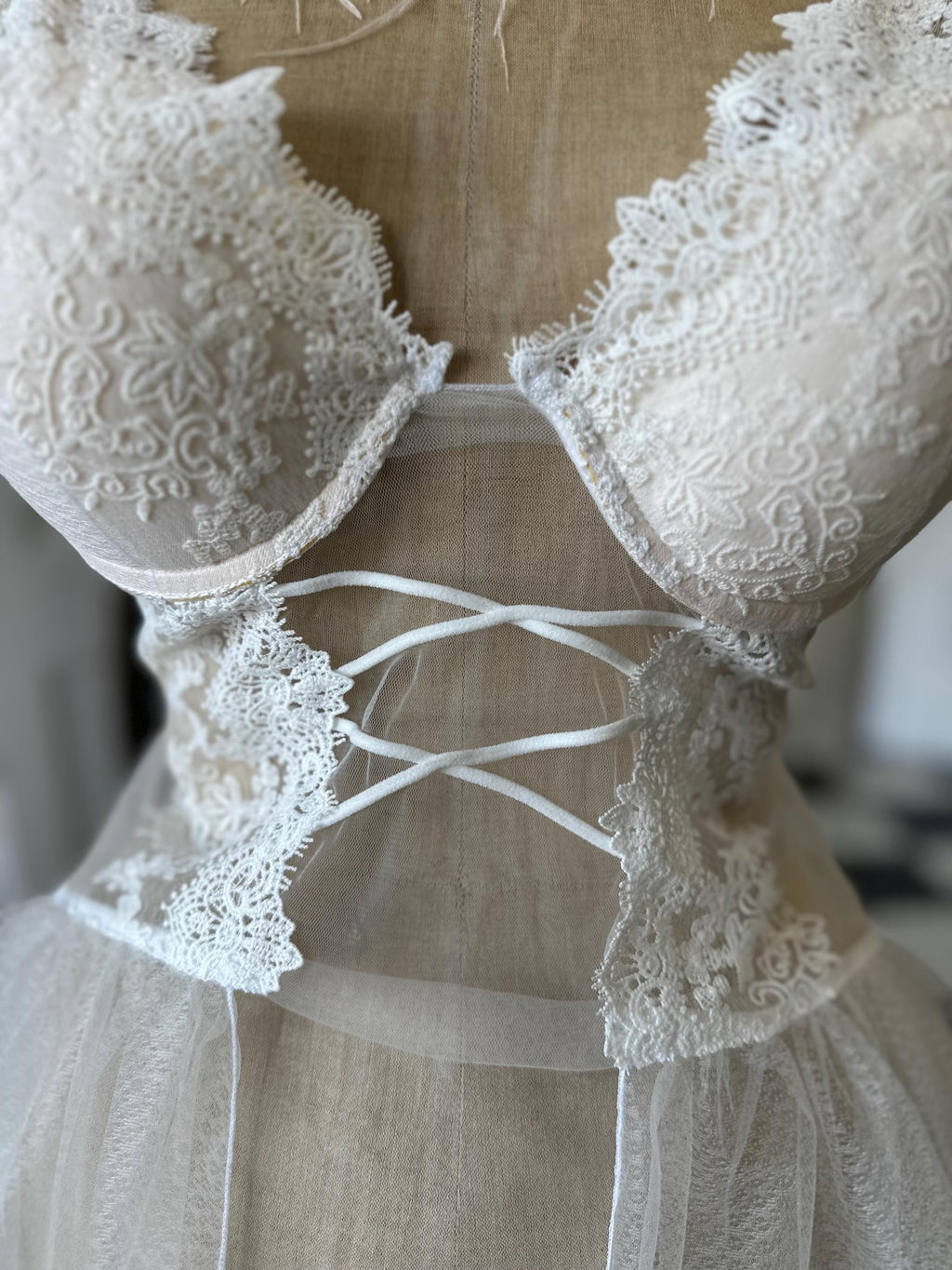 The Seraphina corded lace bridal bustier gown with scolloped peplum and tiered tulle