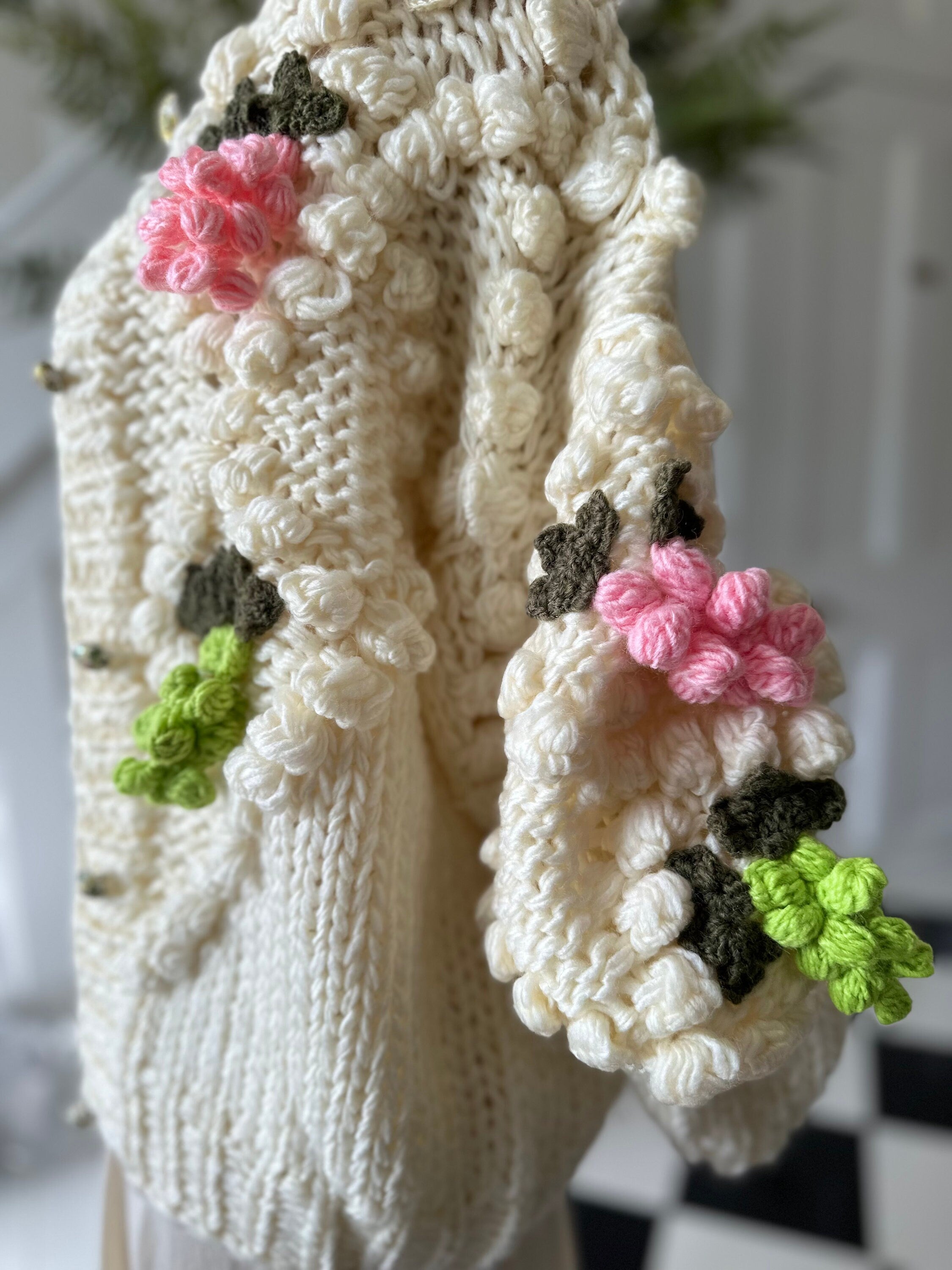 Vintage style hand knitted cream cardigan with grape details