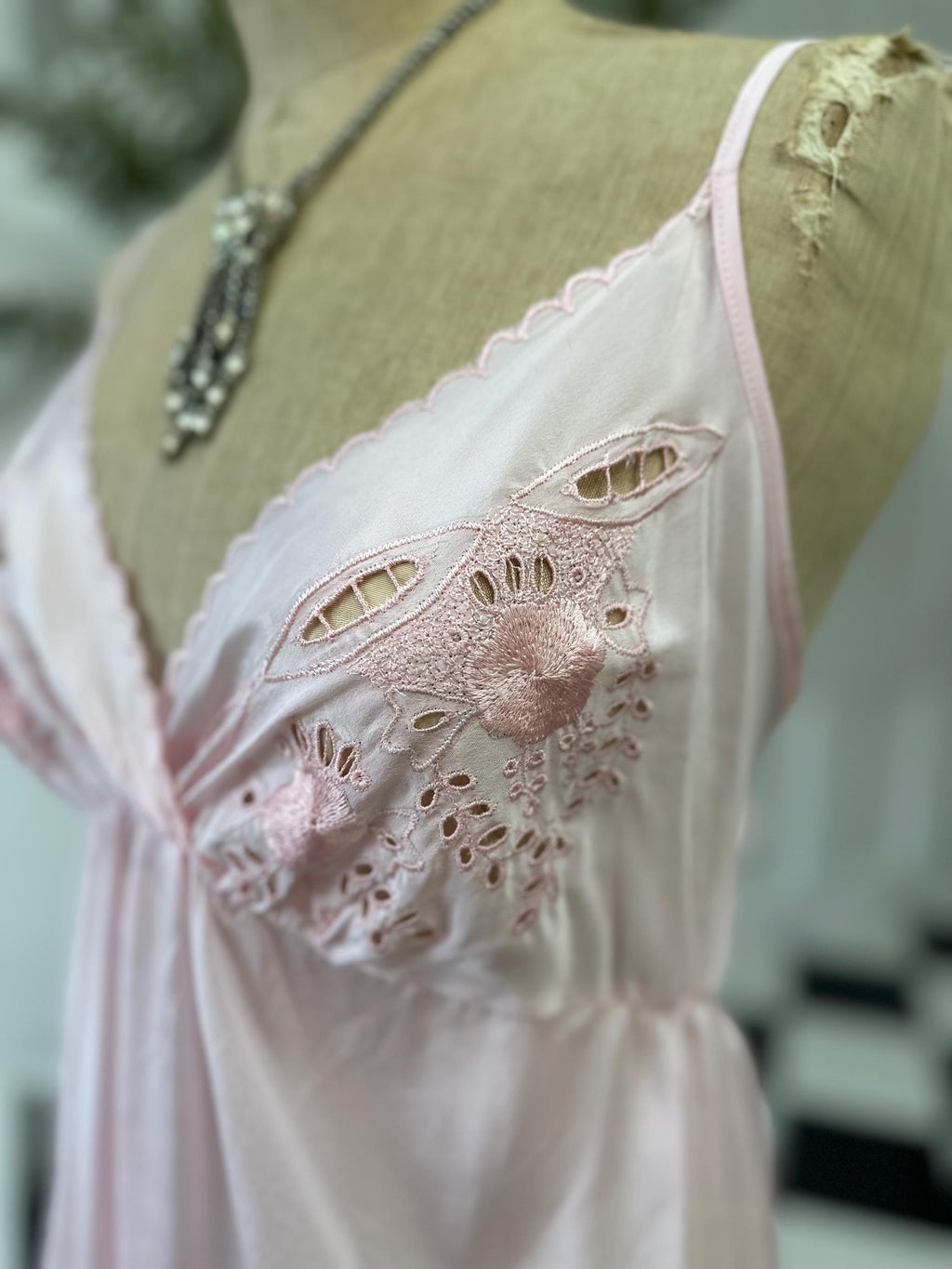 1970s long slip dress in baby pink with embroidery to the front.