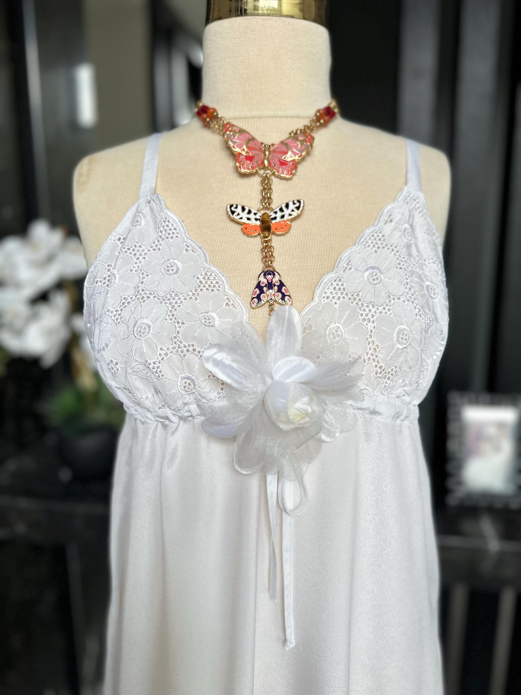 1970s white long satin slip dress with embroidery to the front.