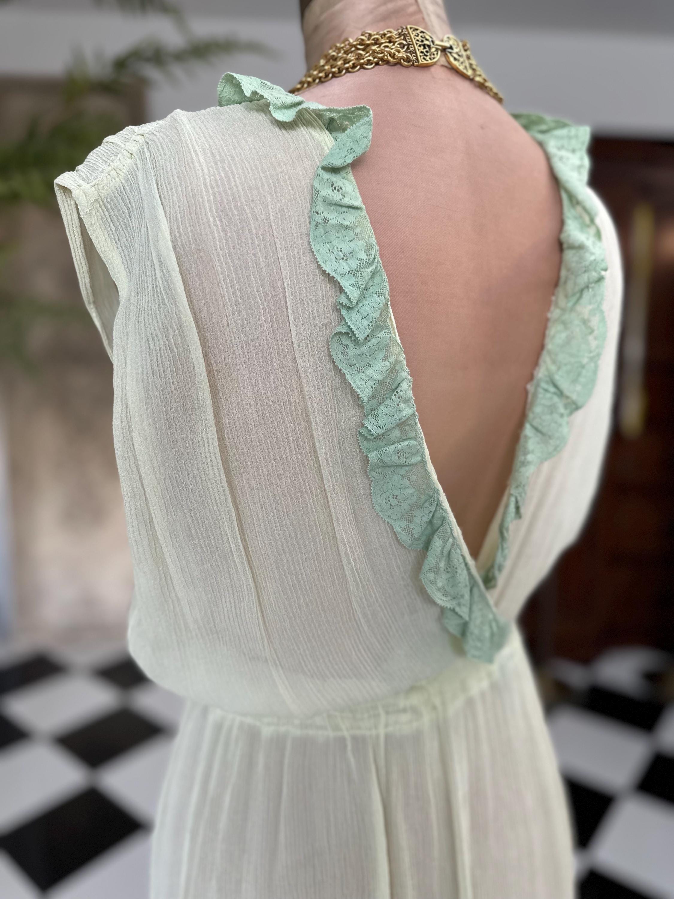 1970s plunge neckline dress in silk crepe  and lace in pale green