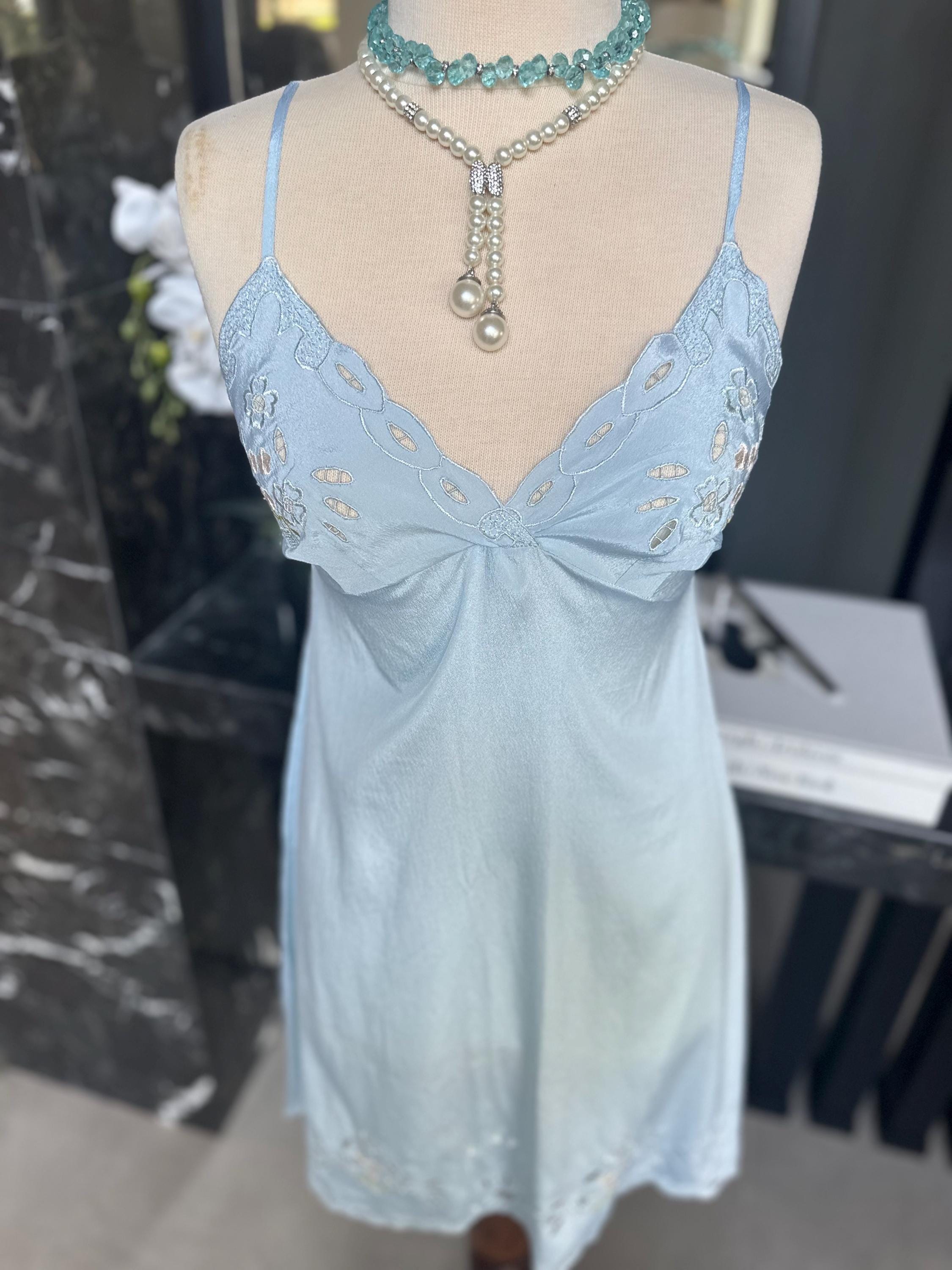 1970s baby blue short satin slip dress with embroidery to the front.