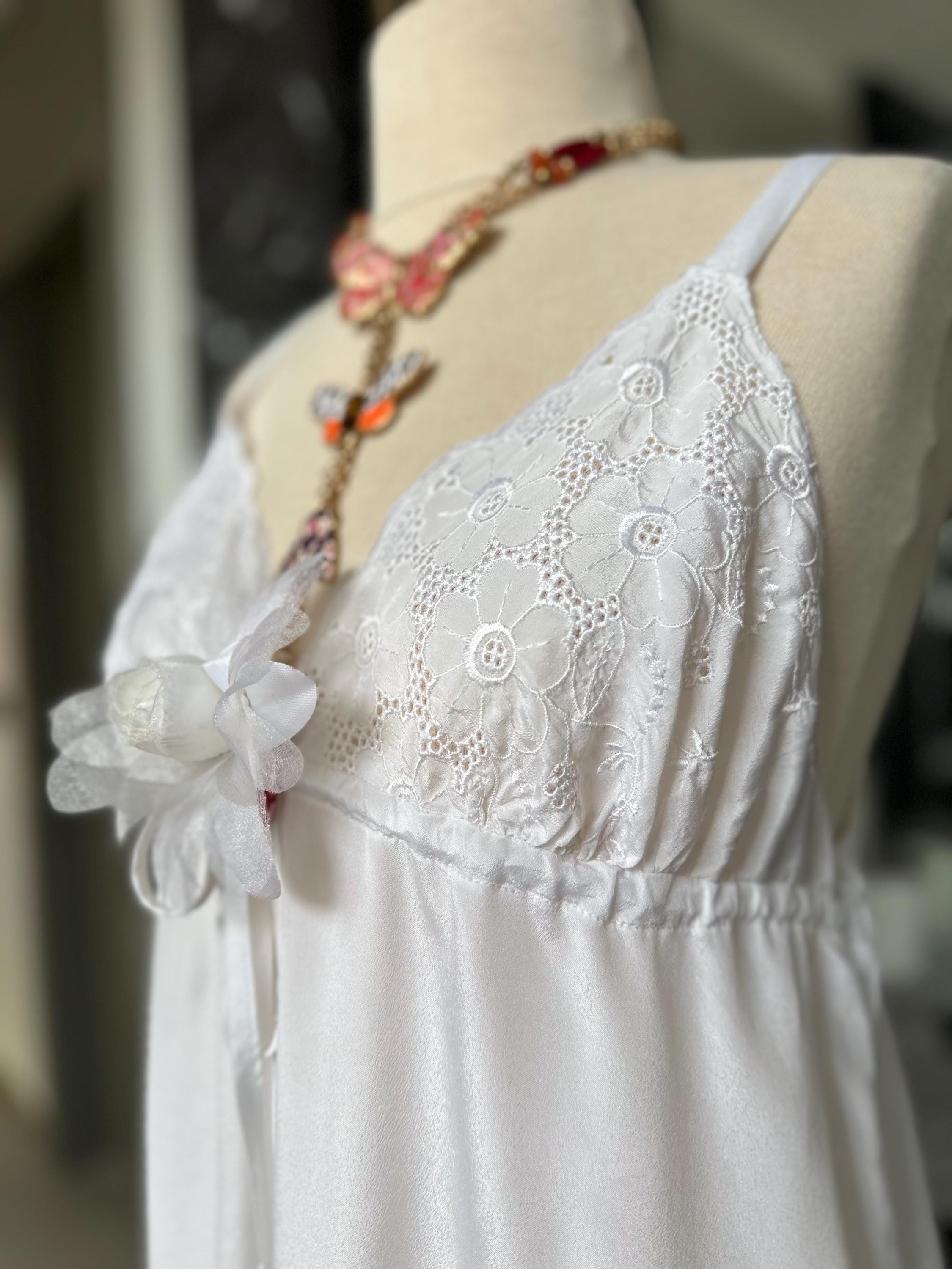 1970s white long satin slip dress with embroidery to the front.