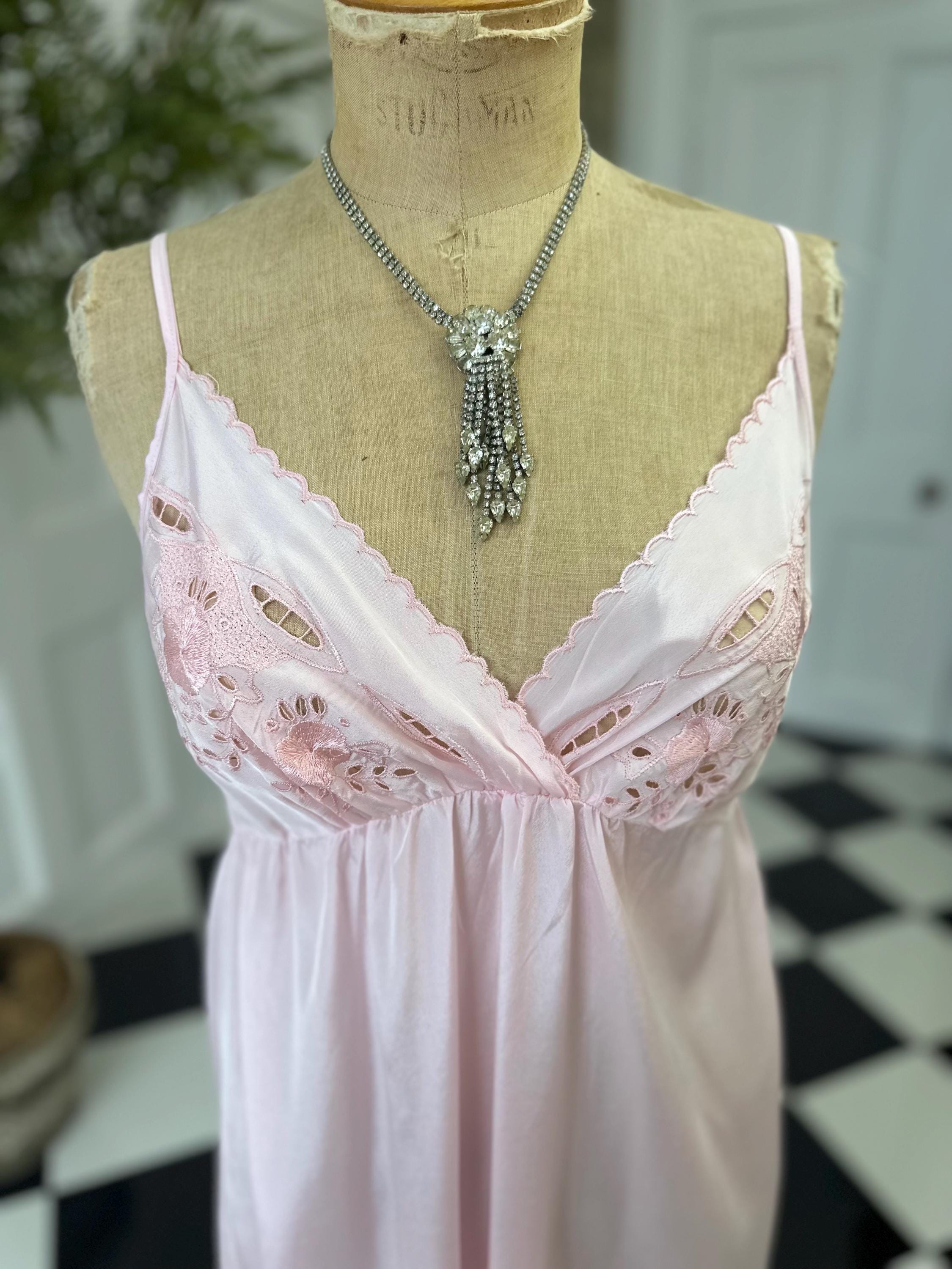 1970s long slip dress in baby pink with embroidery to the front.