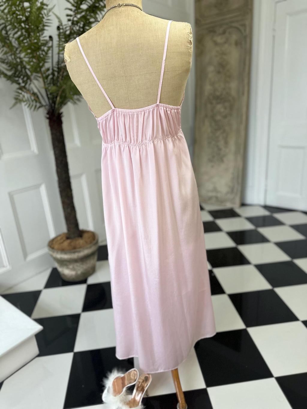 1970s long slip dress in baby pink with embroidery to the front.