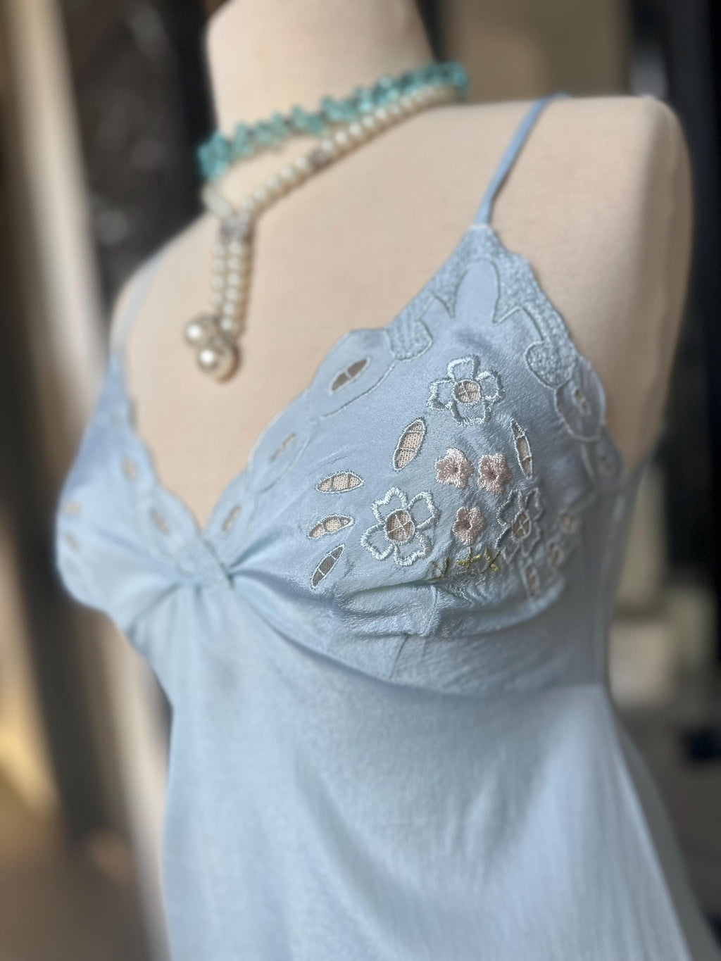1970s baby blue short satin slip dress with embroidery to the front.