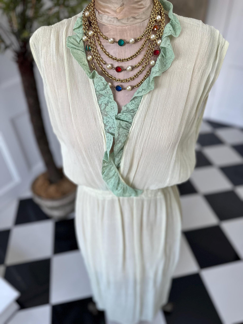 1970s plunge neckline dress in silk crepe  and lace in pale green