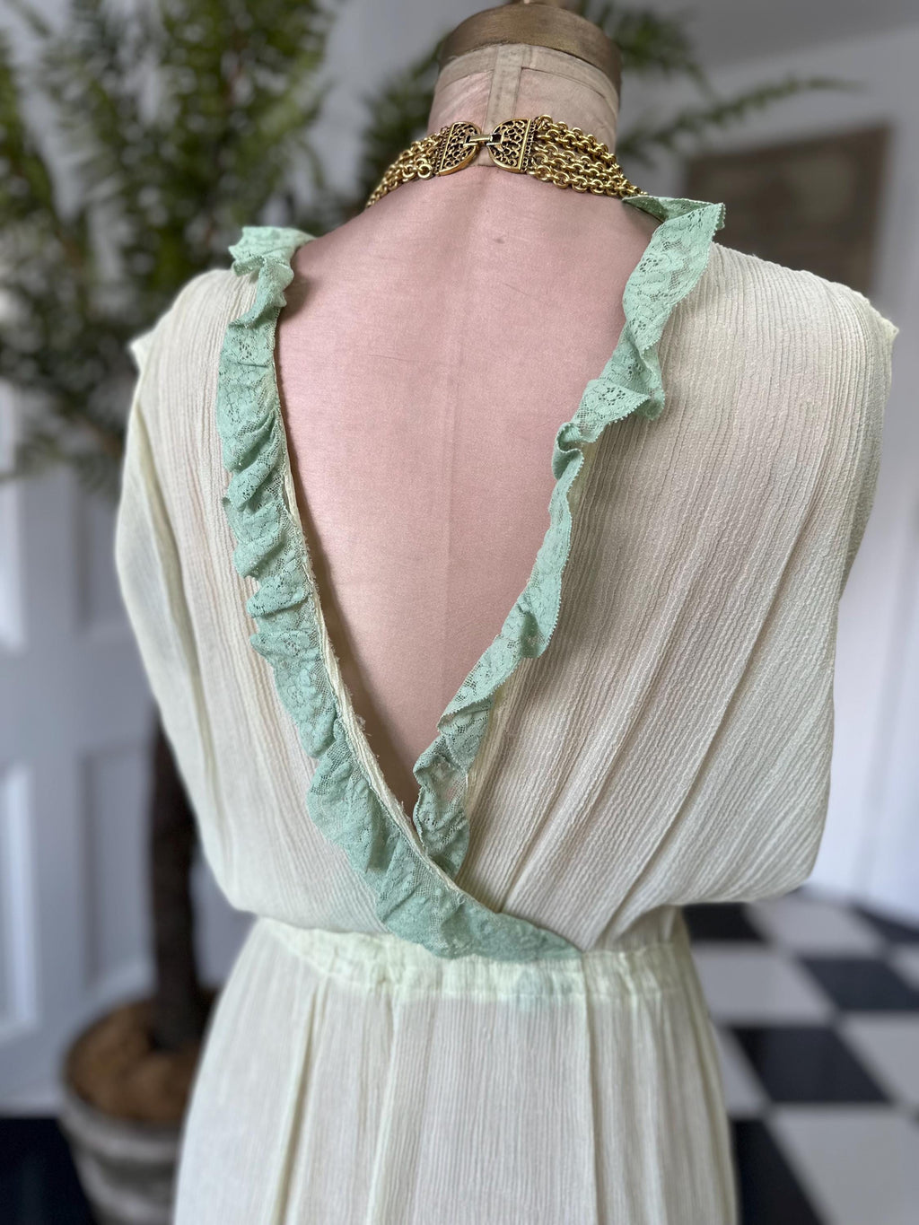 1970s plunge neckline dress in silk crepe  and lace in pale green