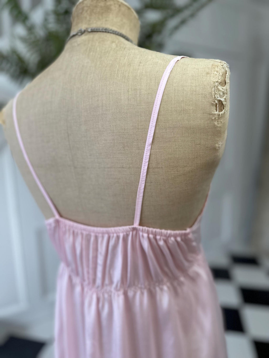 1970s long slip dress in baby pink with embroidery to the front.
