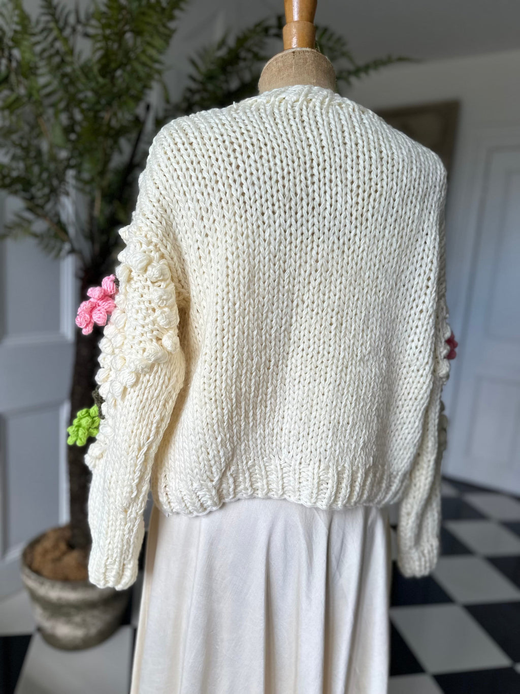 Vintage style hand knitted cream cardigan with grape details