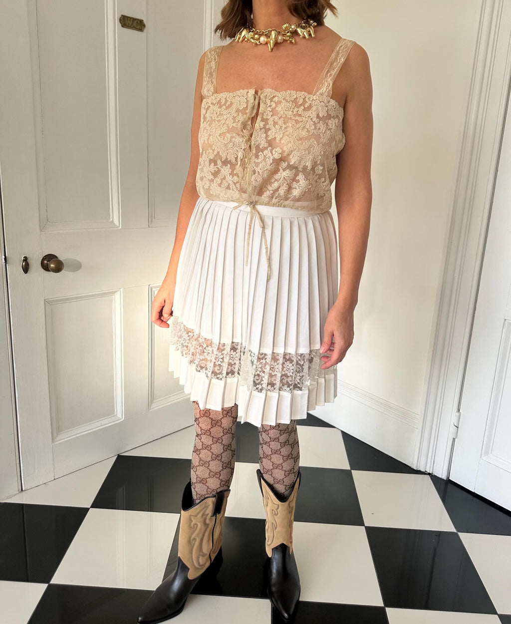 Vintage 1990s white pleated mini skirt with lace detailing