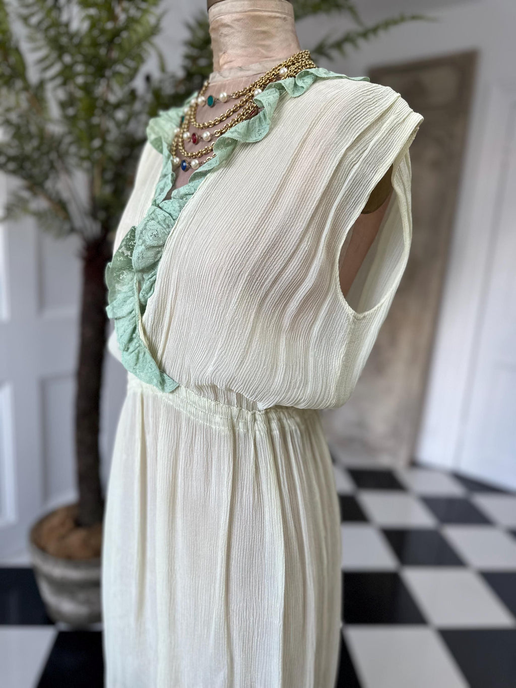 1970s plunge neckline dress in silk crepe  and lace in pale green