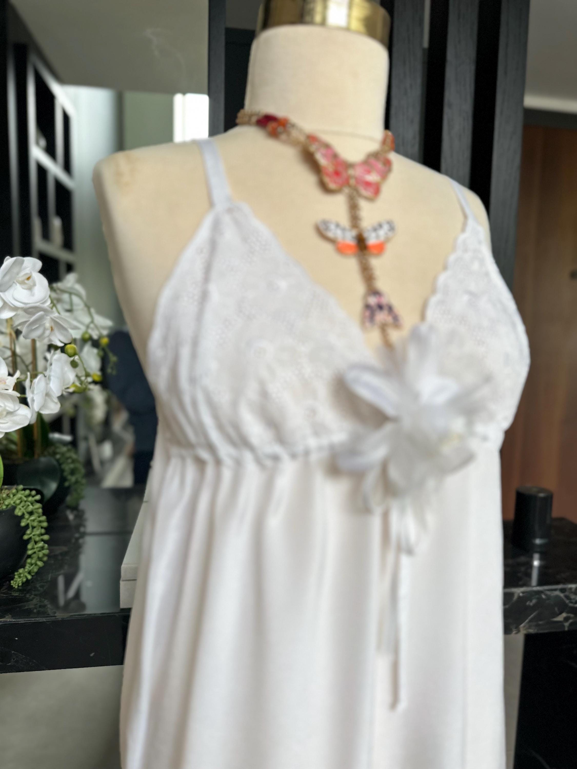 1970s white long satin slip dress with embroidery to the front.