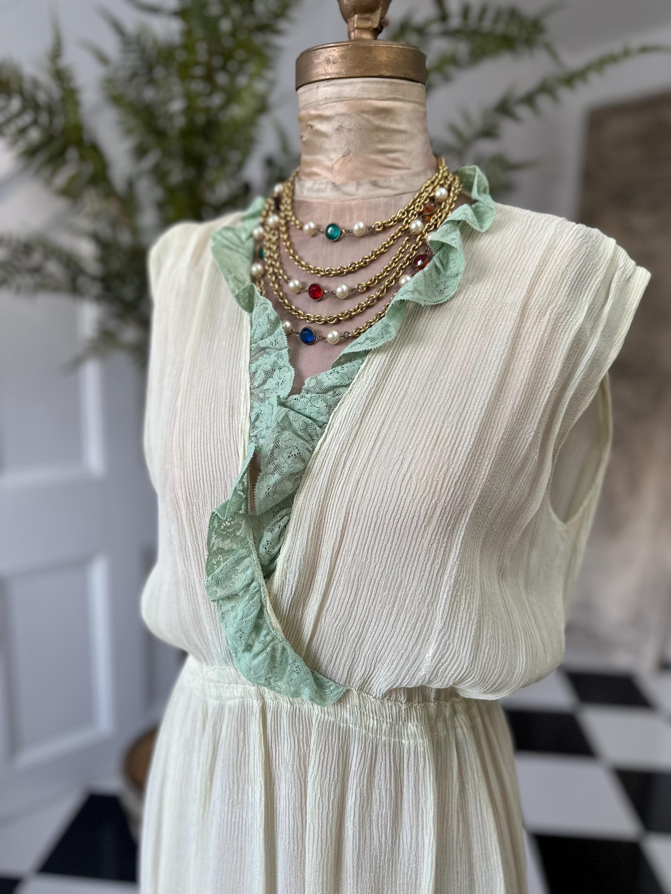 1970s plunge neckline dress in silk crepe  and lace in pale green
