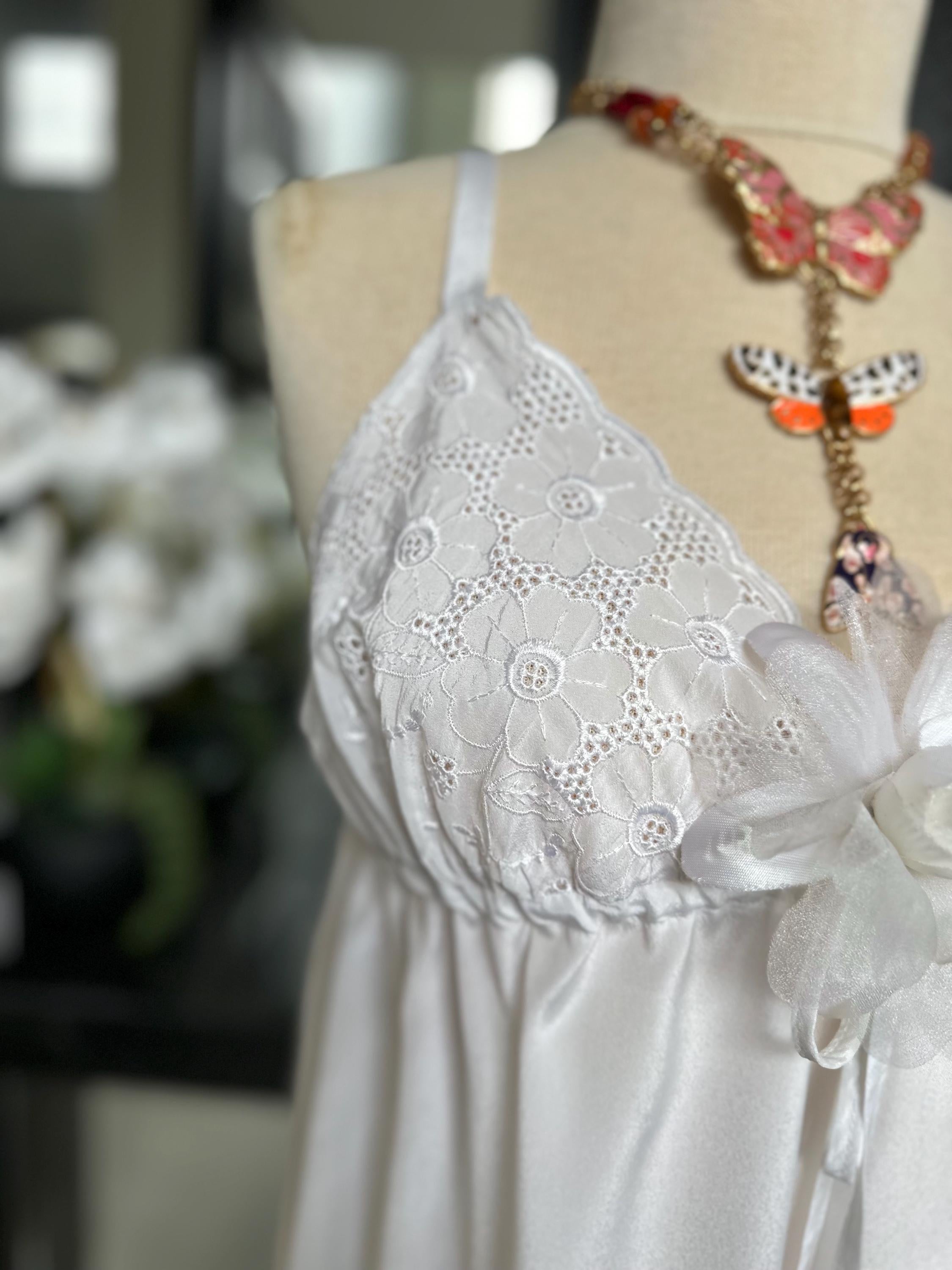 1970s white long satin slip dress with embroidery to the front.